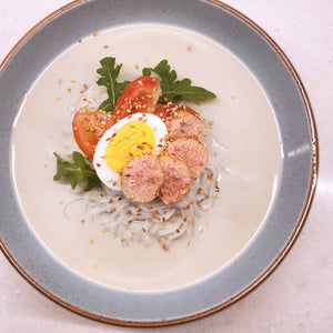 Cold Soy Milk Noodle Soup (콩국수) with Butter Grilled Mentaiko (명란) on a blue plate